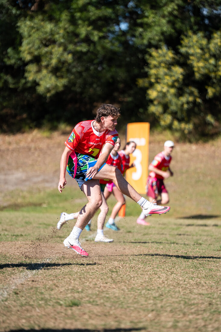 Tag player carrying the ball during a Challenger game